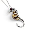 Click to view product details and reviews for Small Seahorse Necklace In Silver And Amber 16 42cm.