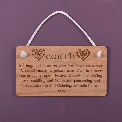 Wooden hanging sign - "cwtch (n) hug or snuggle; but more than that...."...