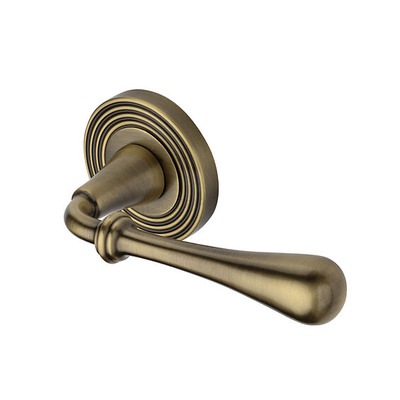 Heritage Brass Roma Reeded Design Door Handles On Round Rose, Antique Brass - RR7156-AT (sold in pairs) ANTIQUE BRASS