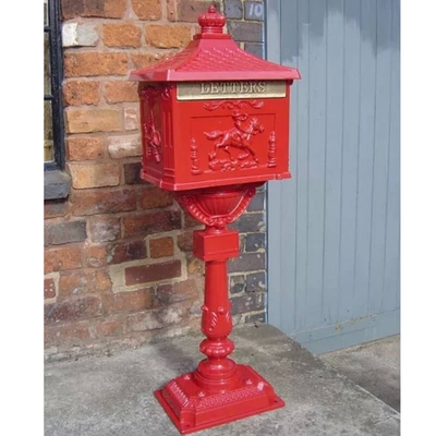 Decorative freestanding, aluminium letter box in red with ornate design