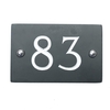 Image of Slate house number 83 v-carved with white infill numbers