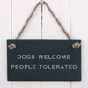 Image of Dogs welcome. People tolerated - slate hanging sign