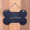 Image of Large Bone Slate hanging sign - "Caution Very affectionate dog" - a great present for a pet owner