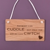 Image of Wooden hanging sign - Anyone can cuddle but only the Welsh can cwtch