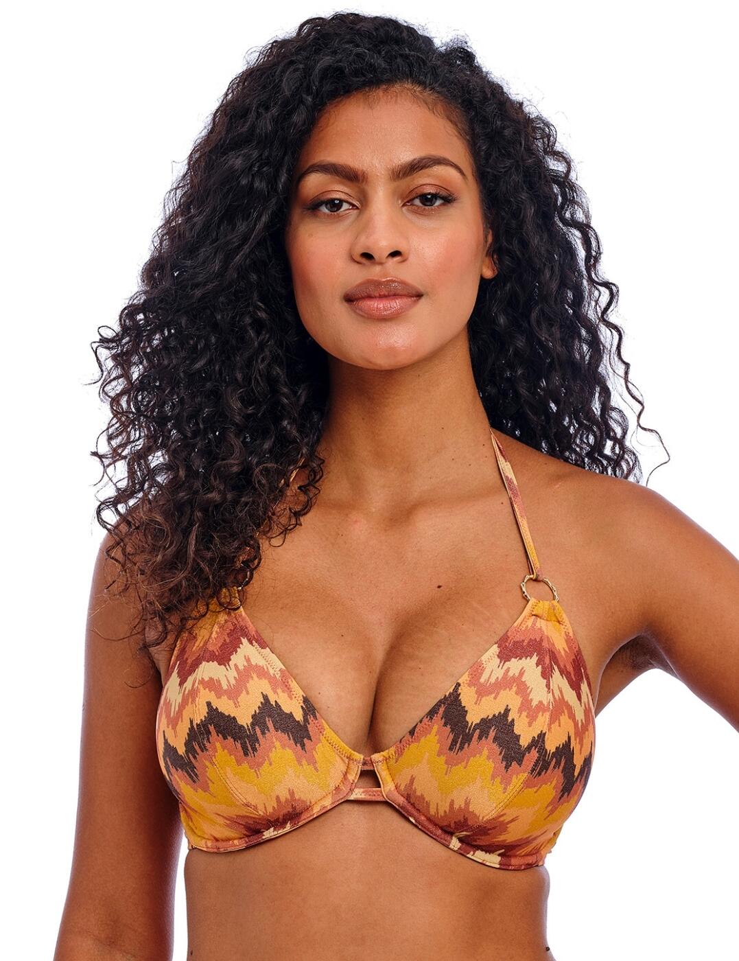 Dive into unparalleled style with the Arizona Wave halter bikini top by Freya. Designed to be the perfect addition to any holiday wardrobe, this sophisticated bikini top promises to enhance your beach days with its underwired, non-padded cups that offer a smooth and natural silhouette. The seductive low plunging neckline, accentuated by chic bamboo ring details, adds a touch of allure, while the metallic yarn features in the fabric bring glamour to your poolside ensemble. Crafted without a cradle for a lighter look and boasting powernet-lined cups, this swimwear essential delivers a bespoke, supportive fit thanks to adjustable halter ties and a secure plastic clasp closure. Why not elevate your holiday wardrobe even further with matching pieces from the Arizona Wave collection?