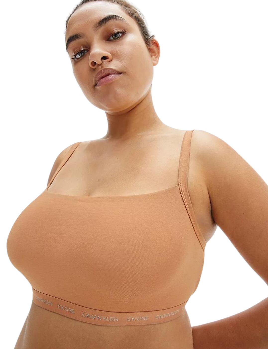 Calvin Klein is renowned for its timeless athleisure style and this pack of 2 unlined bralettes is the perfect example. This convenient pack of two bralettes flaunt the iconic Calvin Klein logo underband for a minimal designer style. The unlined cups and non-wired design creates the utmost comfort that is ideal for all-day wear or lounging. Complete the look with coordinating briefs from the CK One Cotton collection by Calvin Klein.  Iconic Calvin Klein underband Classic sporty bralette shape Unlined and non-padded Non-wired Pull-on design Adjustable straps Country of origin: Sri Lanka Composition: 95% Cotton &pipe; 5% Elastane Listed in UK size  51813-93563 000QF6814E Unlined Bralettes (2PK)
