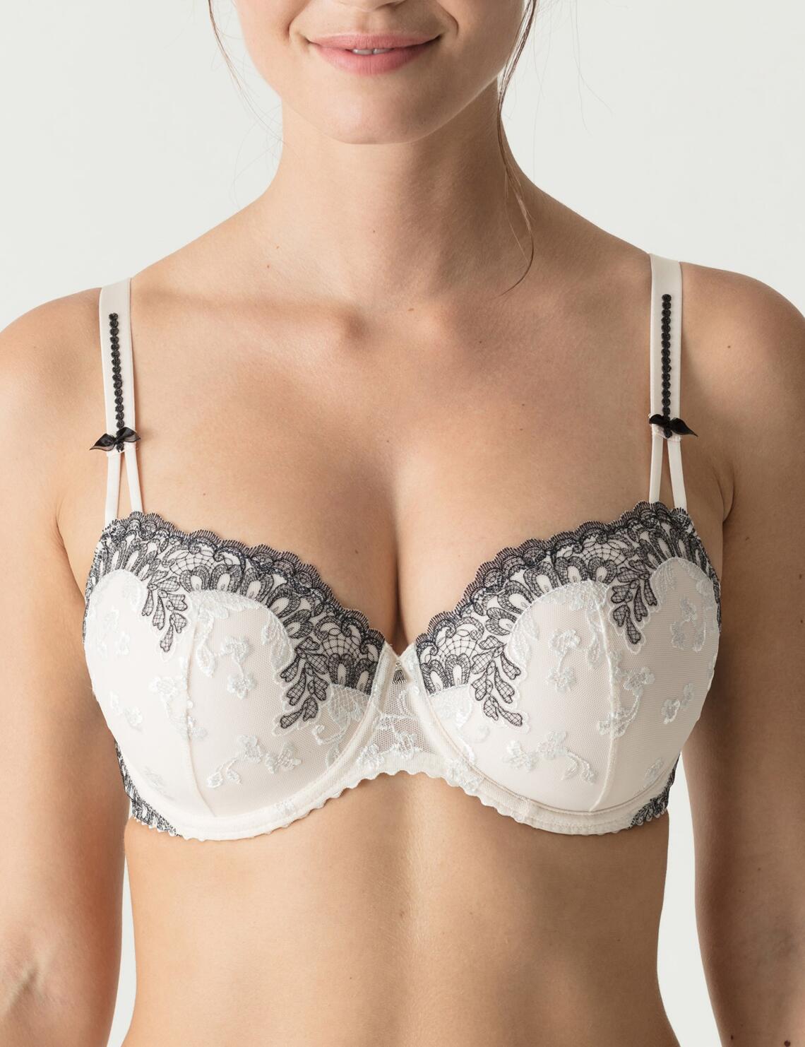 The Prima Donna Promise bra is perfect for those who seek top-tier lingerie. This all new stunning and fabulous range by Prima Donna continues to be key attire in maintaining a chic and sophisticated lingerie collection, combining a comfortable and contemporary fit and feel with full coverage for modesty. Featuring comfortable padded cups, adjustable straps and underwiring for fabulous support and uplift, this beautiful piece is certainly not one to miss out on! The stunning bra is completed in beautiful floral embroidery and elegant bows and can be paired with matching items from the Promise range to create a stunning luxurious look!  Gracious and chic, feminine design Beautiful embroidery styling adorns the cups Complimented with decorative accents Underwired support & uplift Stunning floral embroidery Padded for a comfortable feel Elegant bows Adjustable straps Secures at the rear with hook and eye closure Super soft fabric for the most luxurious feel! Composition:- PA32% &pipe; PES59% &pipe; EL9%% Listed in UK sizes  37736-69257-937199 0262992/0262993 Balcony Bra