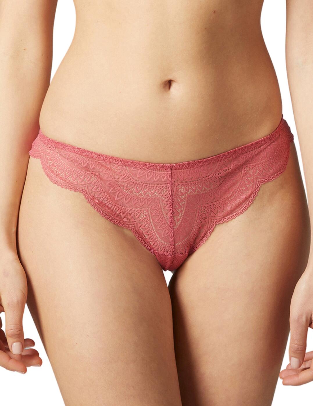 The feminine style of these Karma briefs from Simone Perele is sure to become a new favourite. This piece is made in an alluring tanga style with a low-rise waist and minimal rear coverage for a cheeky but comfortable look. The briefs are made out of delicate semi-sheer lace that feels amazingly indulgent against your skin and creates a pretty look. The scalloped trims on the bottom complete the feminine design.  Minimalistic cheeky design Semi-sheer lace material Scalloped trims on the bottom Low-rise waist Minimal rear coverage Matching coordinates available Composition: 64% Polyamide &pipe; 28% Elastane &pipe; 8% Cotton Listed in UK sizes  55163-98288-1284027 12V710 Tanga Brief