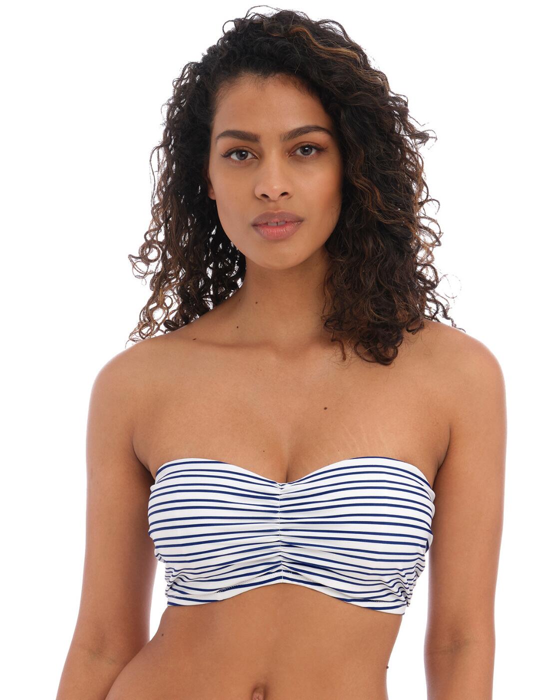 Let’s take a stylistic voyage to the New Shores with Freya’s bandeau bikini top. With a flattering stripe pattern and a bandeau style fit, you'll feel confident and chic while you soak up some sun this season. Made with lightly padded foam cups, you'll get an even, round shape while the balcony neckline allows just enough coverage, even with a playful gathering that flatters your bust. Bunny knot ties on the shoulder straps can be detached or adjusted for total comfort and convenience. Slip into this bikini top with ease thanks to its secure back clasp closure for a snug fit. Not only that, but there are matching coordinates available so creating those perfect poolside outfits has never been easier!  Bandeau bikini top Striped pattern Balcony neckline Lightly padded foam cups for a smooth round shape Non-wired for comfort A flattering gathering at the bust Bunny knot tie-on straps Detachable and adjustable shoulder straps Classic back clasp closure Matching coordinates available Country of origin: Indonesia Composition: 83% Polyamide &pipe; 17% Elastane Listed in UK sizes  60632-105537-1386681 202510 Balcony Bikini Top