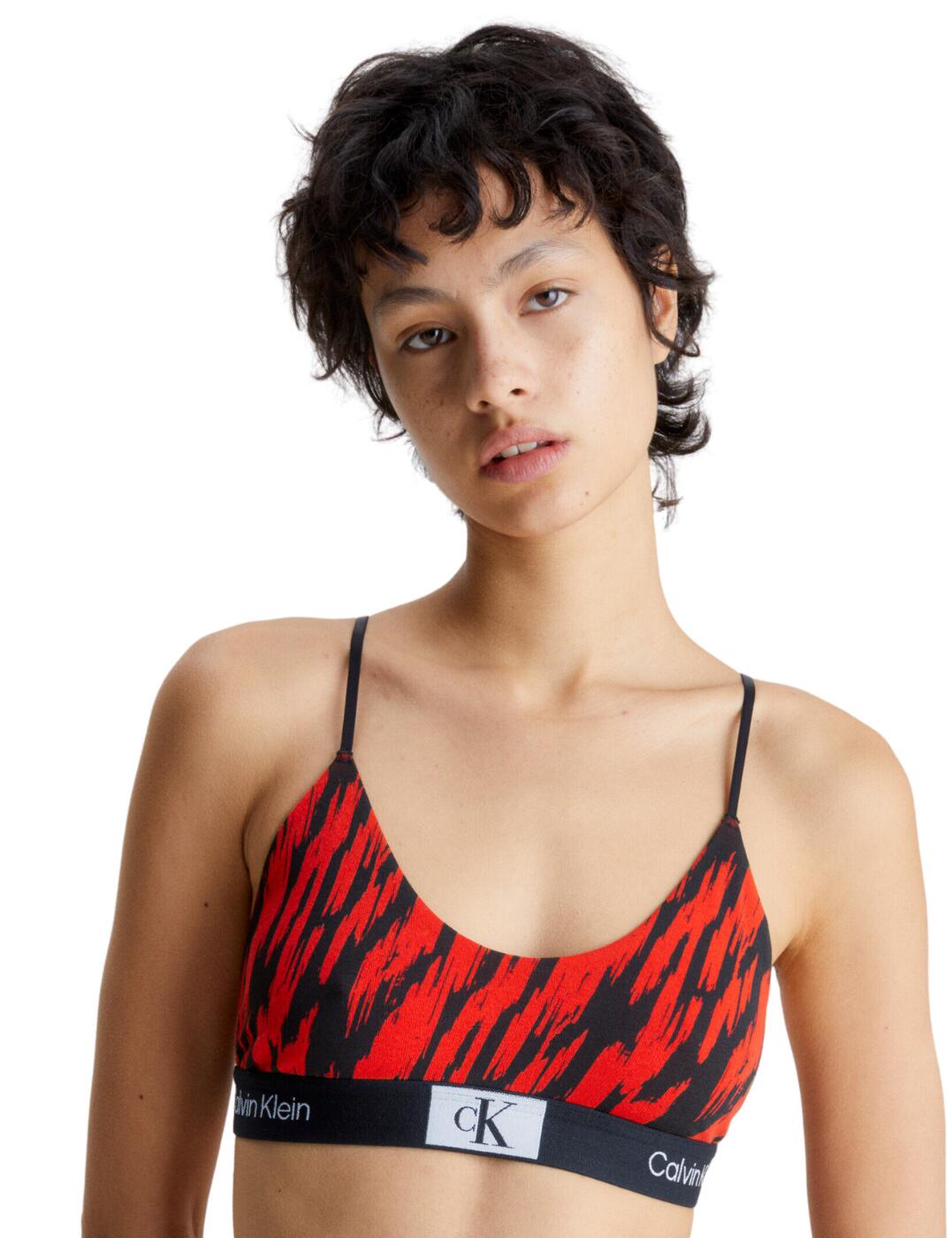 Shake up your lingerie collection with this stylish bralette from the Calvin Klein CK96 range! This stunning bralette is wireless and features soft cups without padding, making it perfect for all-day comfort. The adjustable shoulder straps are great for customising a fit that's tailored to your body and the pull-on design makes this bralette effortless to slip into. Crafted with a Calvin Klein signature elastic underband for that iconic finishing touch. Plus, why not treat yourself to some of its matching lingerie pieces for an effortlessly chic look?  Stunning bralette Soft cups, no padding Wireless Adjustable shoulder straps Pull-on design Calvin Klein signature elastic underband Matching lingerie available Country of origin: India Composition: 69% Cotton &pipe; 21% Recycled Cotton &pipe; 10% Elastane Listed in UK sizes  60679-105602-1399397 000QF7216E Bralette