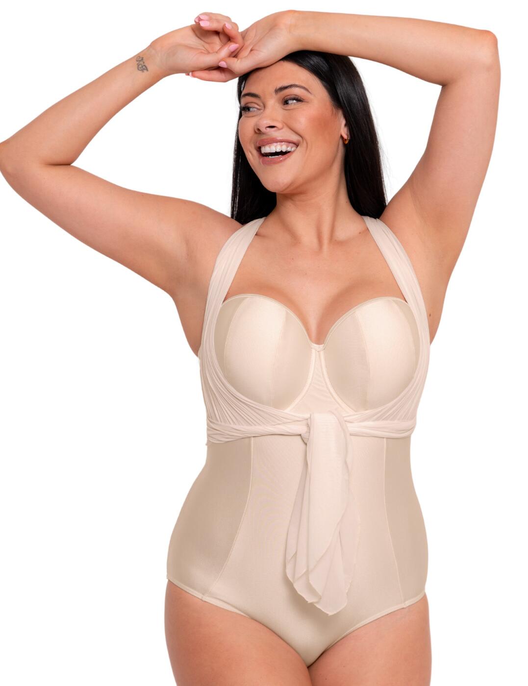 Look and feel your best while wearing the stunning Curvy Kate Wrapsody bandeau swimsuit this season. This chic swimwear offers gorgeous balcony styling with mesh wrap straps for multiple looks. The clip fastening ensures a comfortable yet secure fit, while underwiring provides the necessary support. Boasting non-padded cups and moderate rear coverage, this simple yet elegant design is sure to turn heads as it flatters your curves to perfection. So stay cool on the beach this season in the Wrapsody collection by Curvy Kate.  Gorgeous balcony style swimsuit Strapless with mesh wrap straps for multiple looks Clip fastening Moderate rear coverage Underwired for support Non-padded cups Simple yet elegant design Country of origin: China Composition: Listed in UK sizes  60837-105787-1391783 CS005600 Swimsuit