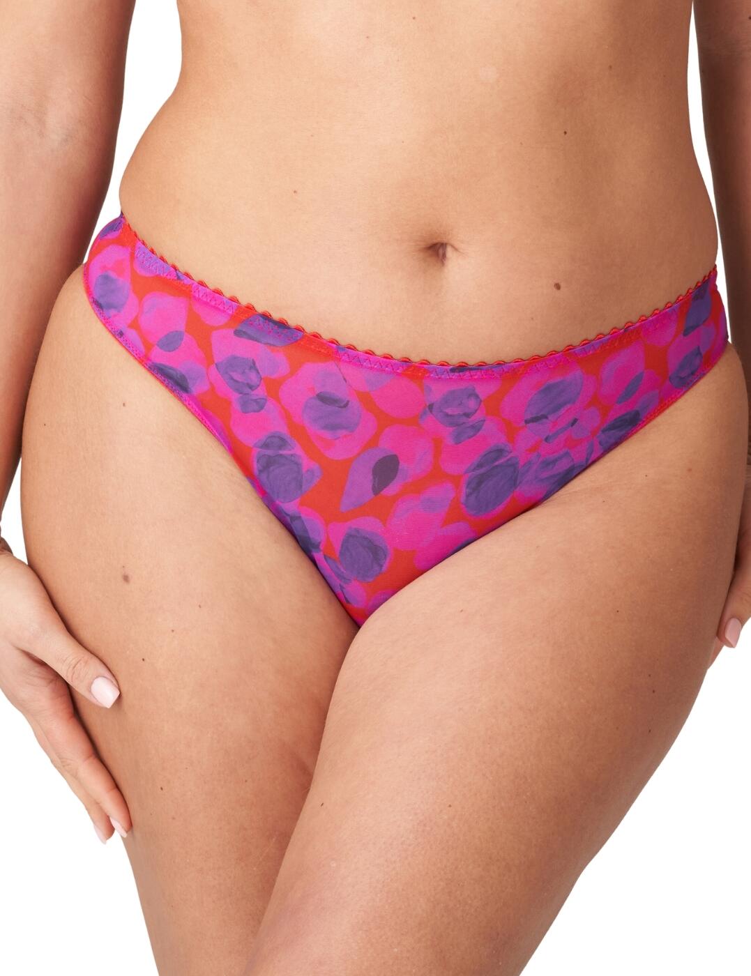 Make your lingerie wardrobe come alive with the Prima Donna Twist Lenox Hill thong! Crafted with comfort and style in mind, this thong offers a flattering shape for all body types. Its mid-rise waist sits perfectly around your hips while providing minimal rear coverage. The flirty design features vibrant colours and an abstract print, plus picot edges along the waistband to top it all off. As an added bonus, matching lingerie is also available so you can create a complete look that's sure to make heads turn!  Flattering shape Mid-rise waist Minimal rear coverage Flirty design with vibrant colours and abstract print Picot edges across the waistband Matching lingerie is also available Country of origin: Tunisia Composition: 67% Polyamide &pipe; 26% Elastane &pipe; 7% Cotton Listed in UK sizes  60883-105833-1393343 0642270 Brief