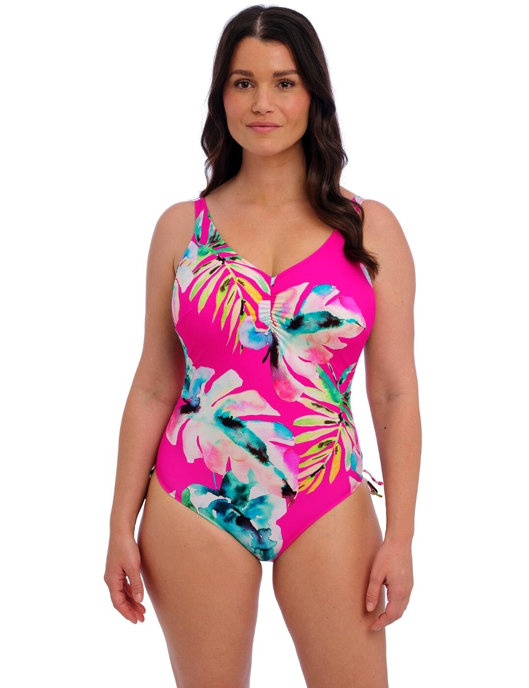 Upgrade your swimwear collection this season with Fantasie Carabelita V-neck swimsuit. The bright floral print adds a fun and vibrant touch, perfect for those sunny days by the water. With full cup coverage and underwire for support, you can confidently enjoy your beach day without worrying about any wardrobe malfunctions. And for those who value comfort, the non-padded feature will make you feel like you're wearing a second skin. The low scoop back adds a touch of playfulness to the design, while still providing coverage and support. This swimsuit is fully lined and has built-up, adjustable shoulder straps for customizable fit and comfort. But the real game-changer is the adjustable side ties that allow for a ruching effect, perfect for those who want to enhance their curves or create a more tailored look. And let's not forget the moderate rear coverage that gives just the right amount of skin without being too revealing.