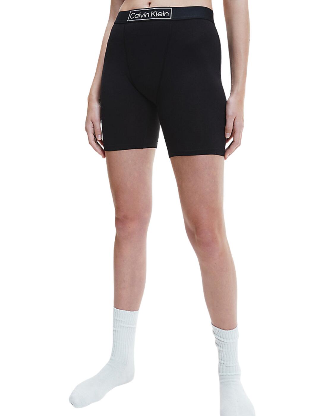 The Reimagined Heritage range by Calvin Klein brings this sleep short in their much-loved classic style. These shorts are perfect for bed or relaxing with a super comfortable fit made from stretch cotton jersey and an easy pull-on style. It has a simple design with a plain opaque material with a Calvin Klein logo at the waistband. The shorts are slim fit and have a mid-rise waist and the shorts sit midway down the thigh.  Sleep shorts Classic style Stretch cotton jersey Pull-on style Calvin Klein logo at waistband Slim fit with a mid-rise waist Country of origin:- Sri Lanka Composition: 70% Organic Cotton &pipe; 20% Recycled Cotton &pipe; 10% Elastane Listed in UK sizes  55495-98950-1298747 000QS6781E Short Brief
