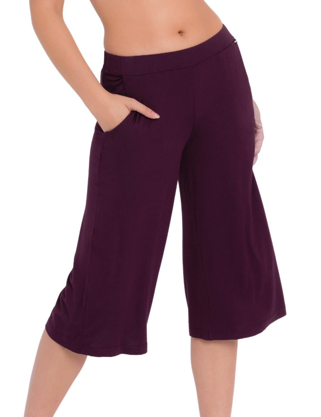 Kick back with the Softease collection by Curvy Kate. These chic pyjama pants are perfect for those lazy mornings. The flared fit and knee-length gives them an ultra-feminine feel and make them oh-so-comfortable! A thick elasticated waistband sits comfortably on your hips and won't dig in or roll. Two side pockets allow you to keep your essentials close by. Pair with your favourite coordinates from the collection to complete the look.  Wide elasticated waistband Two side pockets Flared fit Pull-on Country of origin: China Composition: Main: 94% Viscose &pipe; 6% Elastane Listed in UK sizes  55593-99055-1282979 CN054328 Pyjama Pant