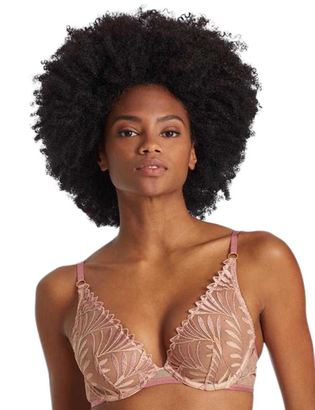 Fashion-forward innovation meets opulence with this Aubade X Iris Van Herpen collaboration. Introduce the Sensory Illusion collection into your lingerie drawer with this gorgeous triangle bra. This bra falls to a deep plunging neckline that showcases your beautiful curves with sensual leaf-inspired embroidery that elegantly drapes over your bust. This beautiful piece is underwired to give a lifted and supported look to the bust with the soft, sheer non-padded soft cups showcasing your natural curves. Straps are fully adjustable and this piece is fastened at the back with a hook and eye closure for a fit you can wear with confidence.  Chic leaf-inspired embroidery Gold-tone hardware to add an opulent touch Hook and eye closure Underwired Sheer non-padded soft cups Fully adjustable shoulder straps Deep plunging neckline Country of origin: Tunisia Composition: Cup Embroidery&pipe; 100% Polyester Composition: Embroidery back: 44% Polyester &pipe; 41% Polyamide &pipe; 15% Elastane Composition: Lining: 100% Polyester Listed in UK sizes  57008-100862-1306987 RCF12 Triangle Bra
