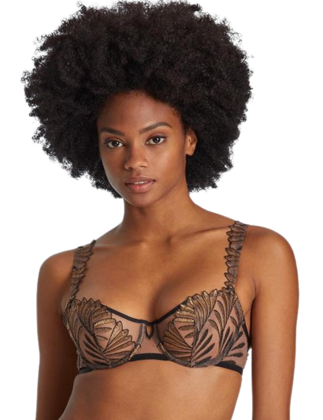 Iris Van Herpen collaborates with Aubade to create the irresistible Sensory Illusion collection which brings nature-inspired designs that add an elevated opulence to your lingerie drawer. This half cup bra is as comfortable as it is gorgeous with the beautiful leaf-inspired embroidery that drapes over your bust and decolletage for a truly iconic finish. This piece is fastened at the rear with a classic hook and eye closure with fully adjustable shoulder straps for a customisable fit. This half cup bra boasts a cut-away detailing on the centre bust for a chic edge. Pair this sensational piece with the available matching items within Aubade's Sensory Illusion line to complete this set.  Gold-tone hardware for a chic look Half cup bra V opening centre bust for a sensual finish Leaf-inspired embroidery on cups and straps Underwired Non-padded Country of origin: Tunisia Composition: Cup Embroidery: 100% Polyester Composition: Front Embroidery: 57% Polyester &pipe; 31% Polyamide &pipe; 12% Elastane Composition: Embroidery Back: 44% Polyester &pipe; 41% Polyamide &pipe; 15% Elastane Composition: Lining: 100% Polyester Listed in UK sizes  57009-100848-1306864 RCF14 Half Cup Bra