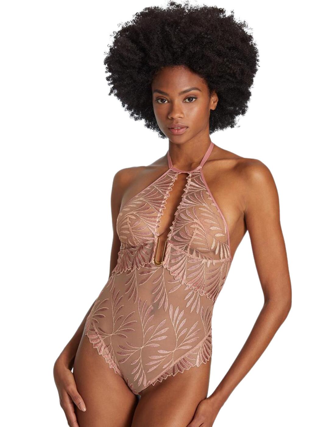 For breathtaking designs look no further than Aubade's iconic fashion-forward Sensory Illusion collection. An innovative collaboration with the bold Iris Van Herpen, this bodysuit blends leaf-inspired embroidery with modern classic cuts. This bodysuit is designed to be seen, crafted with gorgeous foliage-inspired embroidery that drapes and adorns your curves creating a chic look that is truly irresistible. This bodysuit boasts gold-tone hardware that is complete with an on-trend U-shaped pendant that sits comfortably on the centre bust. This bodysuit features a halterneck design and is fastened with a G-hook clip and also has a closure on the gusset.  Beautiful and iconic! Halterneck design Gold-tone U-shaped charm on centre bust Closure on gusset Plunge keyhole design at the bust Backless design Moderate rear coverage Gorgeous leaf-inspired embroidery Country of origin: Tunisia Composition: Embroidery: 44% Polyester &pipe; 41% Polyamide &pipe; 15% Elastane Composition: Cup Embroidery: 100% Polyester Composition: Embroidery Front And Back: 60% Polyester &pipe; 29% Polyamide &pipe; 11% Elastane Composition: Seat: 100% Cotton Listed in UK sizes  57014-100867-1307094 RC86 Body