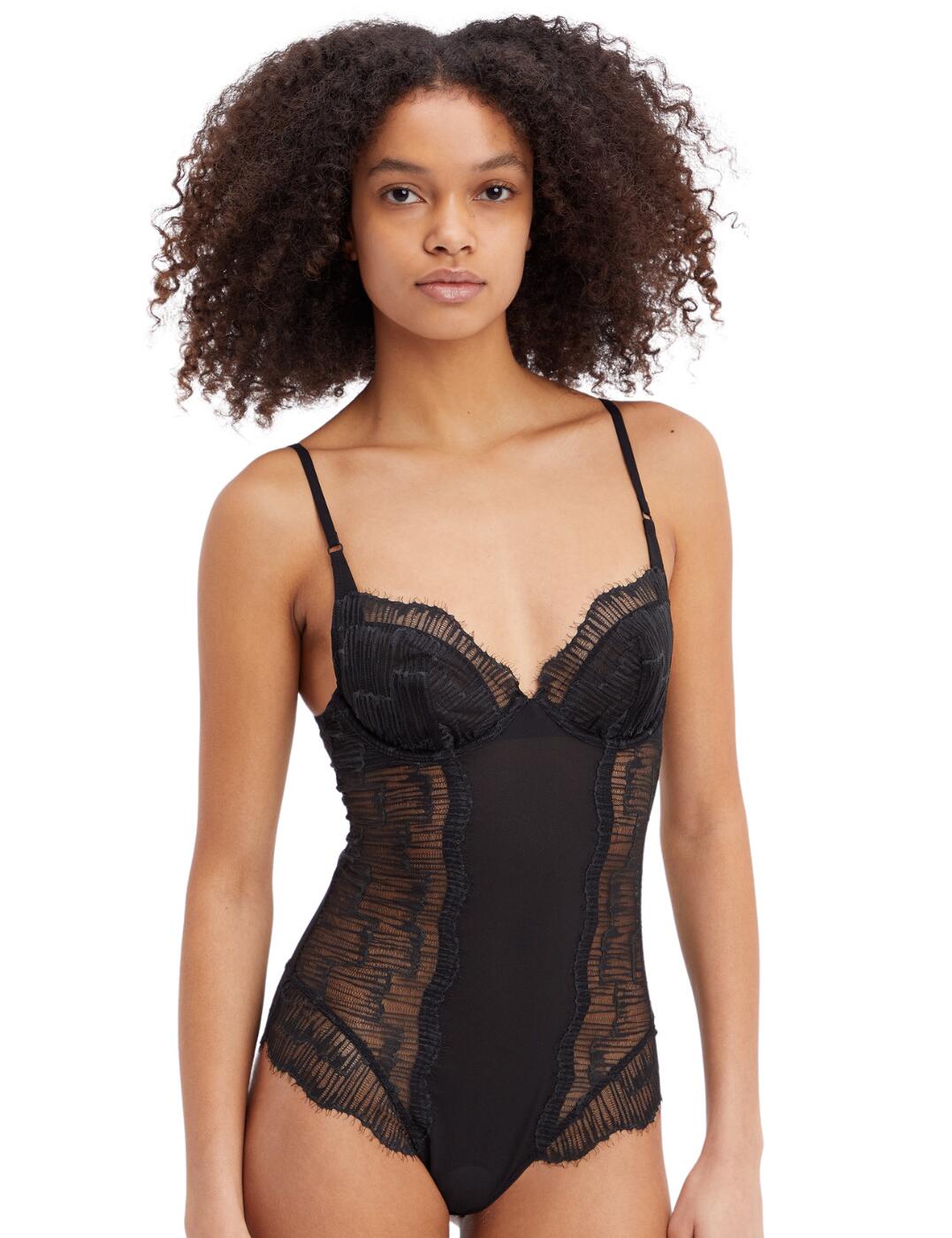 Feel sensual in Calvin Klein's CK Black Linear Lace collection. This bodysuit frames your silhouette delicately with the sheer mesh around the sides and back, meeting at an opaque stripe down the front. The plunging neckline shows off your bust and decolletage while the underwire provides support. Scalloped edges add elegance to the bodysuit. The zip fastening at the back and the adjustable straps ensure it is always a perfect fit.  Underwired Non-padded Zip fastening Plunge neckline Scalloped edges Adjustable straps Moderate coverage Country of origin: China Composition: 93% Polyamide &pipe; 7% Elastane Listed in UK sizes  57219-101142-1310739 000QF6957E  Bodysuit