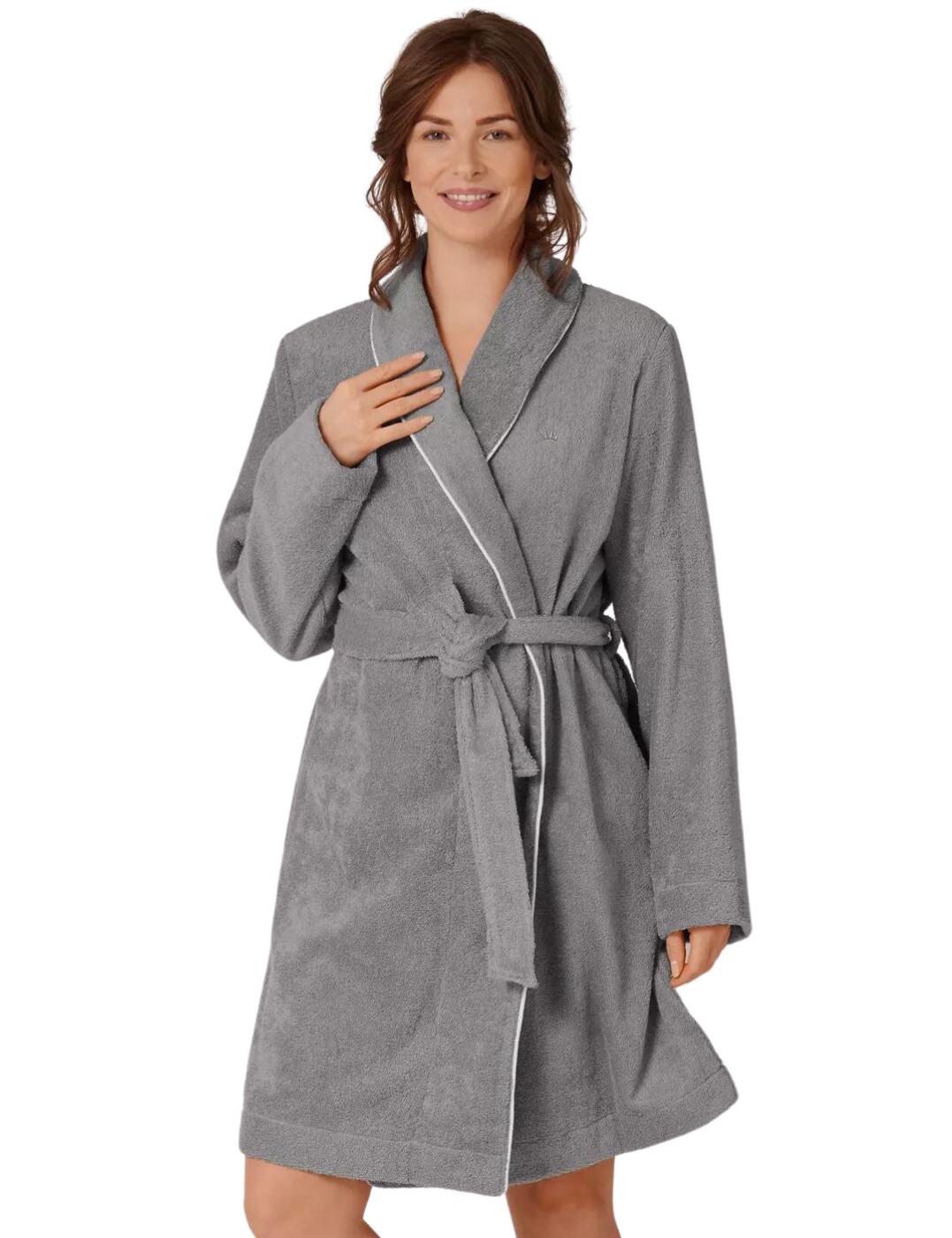 This luxurious robe from the Lounge-Me series by Triumph is an absolute essential to every woman's loungewear collection. The timeless design boasts a collared neckline with piping detail creating an elegant sophisticated style. Long sleeves and the luxurious fluffy fabric will keep you warm and the adjustable tie belt ensures the perfect fit. Explore the Lounge-Me collection by Triumph for more luxurious loungewear essentials.  Luxurious fluffy fabric Long sleeves Collared design with piping detail Knee length Country of origin: China Composition: 100% Cotton Listed in UK sizes  57241-101168-1308700 10206014 Robe