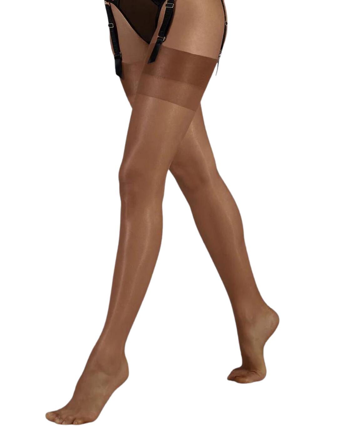 Bluebella brings you seduction with a contemporary twist with these beautifully soft plain top stockings. These stockings boast a 10 denier finish with a sheer matte effect that's guaranteed to add a sensual, sophisticated flair to any lingerie set. Designed to add a premium look, these plain top stockings flatter your legs with the sheer finish creating a smooth flawless look. The wide simple band on the top of these stockings offers a modern feel to this classic piece.  Premium, high-quality stockings 10 denier with a sheer matte finish Smooths and adds a flawless look to the leg Wide minimalist band on the top for a modern effect Wear with a suspender belt to complete the look Country of origin: Italy Composition: 85% Polyamide &pipe; 15% Elastane Listed in UK sizes  41461-CL-S 41461  Plain Top Stockings