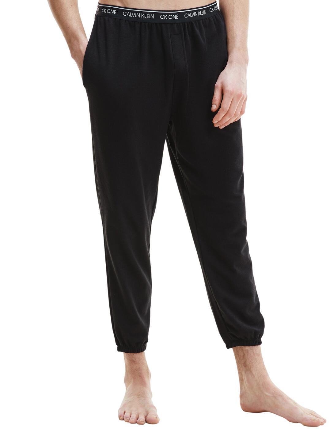 Add a touch of timeless athleisure aesthetic style to your loungewear collection with these Modern Cotton joggers by Calvin Klein. These chic joggers are lightweight and are perfect as sleepwear or for lounging. The slim-fit design and cuffed ankles highlight your legs. The Calvin Klein branded waistband creates the iconic designer look. The pull-on design and side pockets allow for easy everyday wear.  Calvin Klein branded waistband Mid-rise waist Slim fit Side pockets Full length Cuffed ankles Pull-on design Country of origin: Sri Lanka Composition: 57% Cotton &pipe; 38% Polyester &pipe; 5% Elastane Listed in UK sizes  57073-100937 000NM1866E  Men's Joggers