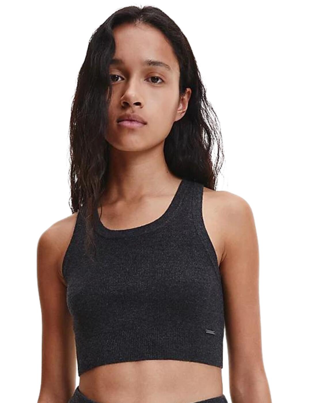 Calvin Klein brings you comfort that cannot be missed with their Sweater Lounge collection. This pyjama tank top boasts a cropped length that allows for true freedom of movement whilst you sleep for a comfortable fit. Crafted with a soft, stretch wool blend that is guaranteed to keep you cosy whilst still being soft against the skin. A staple for any night in, this pyjama tank top features a signature Calvin Klein logo detailing to give a chic designer edge to this classic piece.  Soft wool blend Cropped fit Non-wired Signature Calvin Klein logo detailing Sleeveless design Composition: 50% Wool &pipe; 30% Nylon &pipe; 20% Acrylics Listed in UK sizes  57443-101448-1315936 000QS6845E Pyjama Top