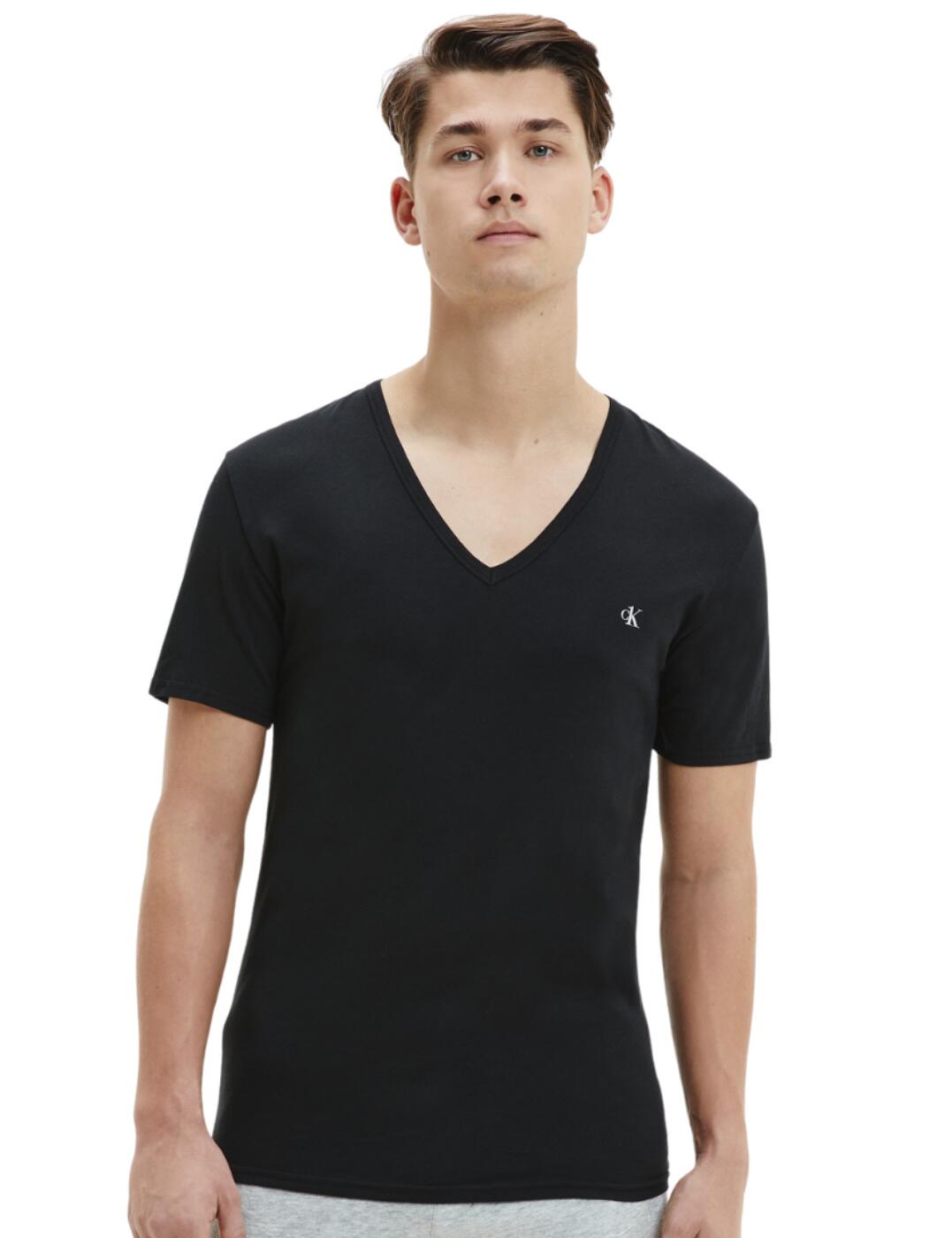 The CK One v-neck t-shirt brings that sleek designer look that you would be searching for in terms of that everyday luxurious loungewear. The t-shirt has the iconic CK logo perfectly placed on the left-hand side of the v-neck design, having this logo makes this t-shirt that much more special, enabling flaunting, whereby this convenient multipack of 2 gives you more chances to do so.  CK One range Multipack of 2 Short sleeved V-neck design Calvin Klein logo Regular fit Country of origin: India Composition: 95% Cotton &pipe; 5% Elastane Listed in UK sizes  57118-100991-1310002 000NB2408A Men's V Neck T-Shirt