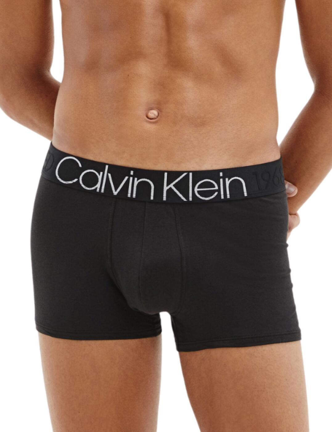 These Evolution Cotton trunk briefs scream iconic with the Calvin Klein logo written in big bold writing across the waistband with subtle 'established in 1968' written in line with the logo, continuing around to the back where a small label also states this is smaller text. These are more of a flaunting style to your everyday look but yet still as comfy and flattering.  Iconic style trunks Signature Calvin Klein logo across the waistband Stretchy soft material Mid-rise waist Country of origin: Sri Lanka Composition: 92% Cotton &pipe; 8% Elastane Listed in UK sizes  57148-101025 000NB1565A Men's Trunks