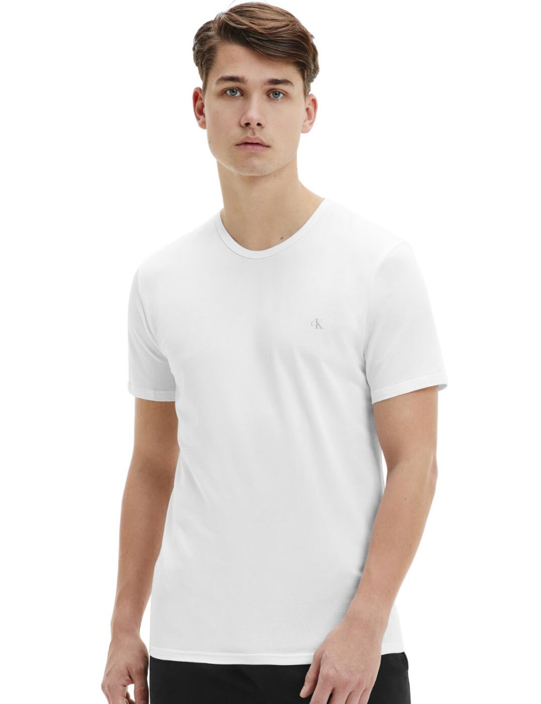 Add a stylish look to your wardrobe with these CK One classic crew neck t-shirts. This design creates a timeless appearance with a classic regular fit and a plain opaque style. It has a round neckline and short sleeves creating a casual relaxed look. It is made complete with a mini square patch that features the CK logo that gives off a contemporary designer look. This is a perfect everyday t-shirt and to make it even better it comes in a pack of 2!  Pack of 2 classic t-shirts Timeless design Rounded neckline Short sleeves Mini square patch with the CK logo Country of origin: India Composition: 95% Cotton &pipe; 5% Elastane Listed in UK sizes  57163-101044 000NB2221A Men's Crew Neck T-Shirt