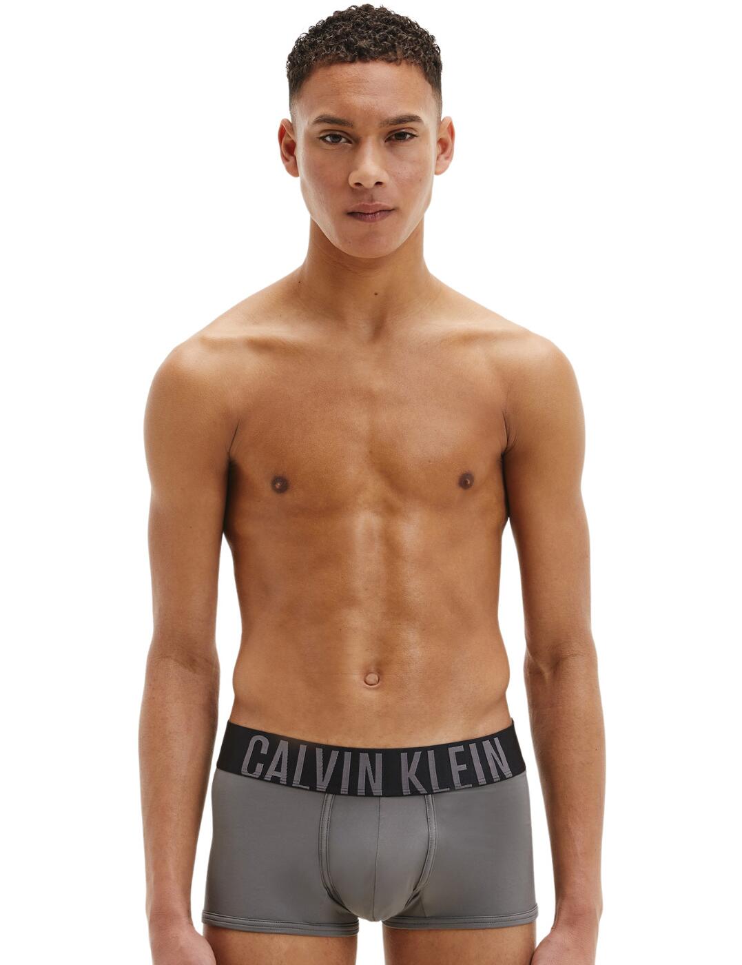 Minimalist silhouettes with a silky soft surface are an absolute need for anyone. The bold Calvin Klein wide waistband on this low-rise trunk makes a designer statement, the Intense Power collection creates updated looks to the classic Calvin Klein underwear design. The amazing stretch on these trunks provides the desired fit.  Low-rise fit Short length Multipack of 2 Bold Calvin Klein waistband logo Country of origin: India Composition: 88% Polyester pes &pipe; 12% Elastane Listed in UK sizes  57190-101088-1310518 000NB2599A Men's Trunks