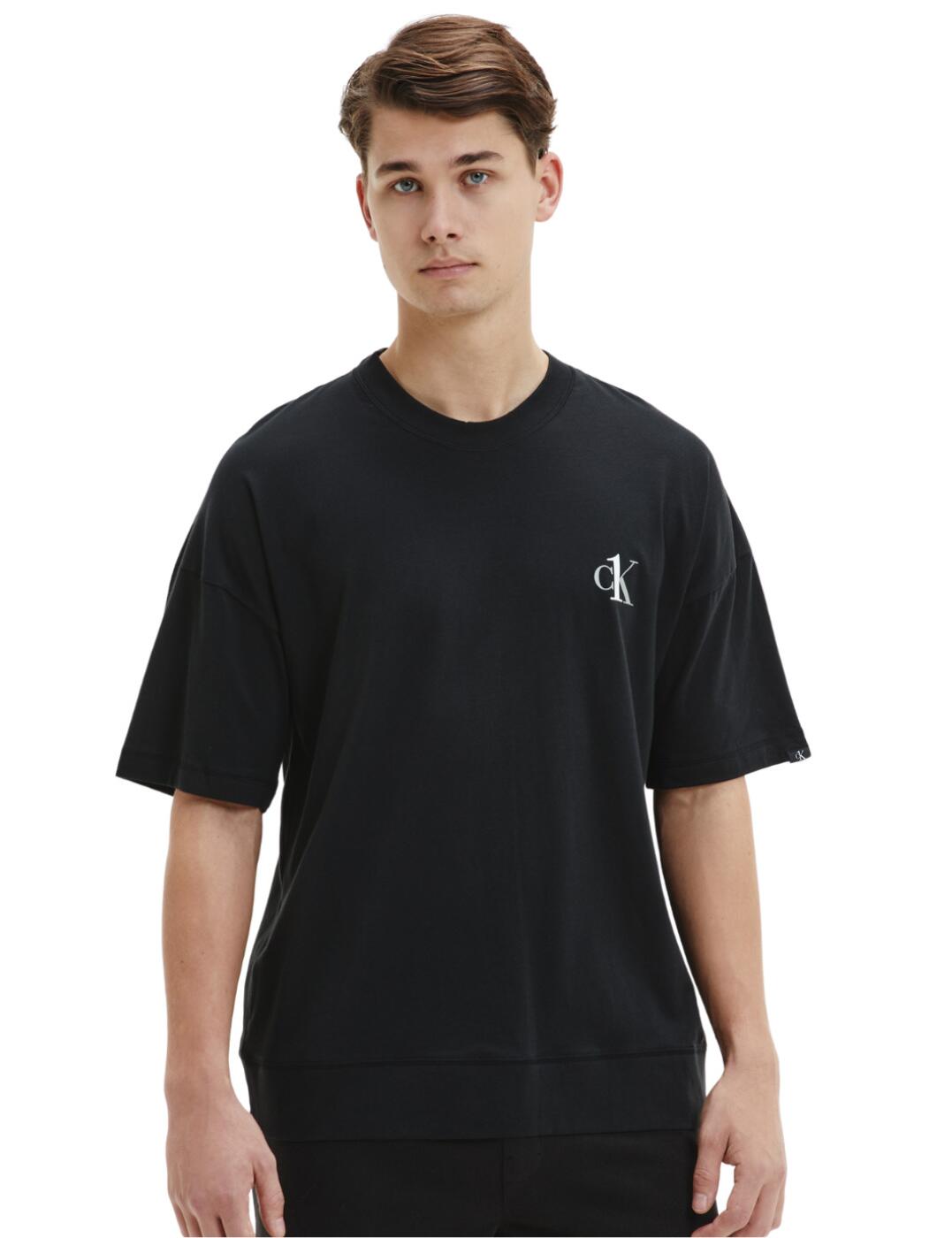 This CK One crew neck tee boasts a designer aesthetic with the CK logo placed proudly on the left. Giving that little extra class CK labeling lays on the bottom of the sleeve. The tee has a slightly oversized fit, which gives extra comfort and is more breathable. You could also wear this tee as loungewear as well as outerwear as this can be easily paired up with a pair of lounge bottoms to create the ultimate cosy night in attire.  CK logo branding Short sleeved Soft and comfortable fit Breathable material From the CK One range Multi-wear style Country of origin: Sri Lanka Composition: 95% Cotton &pipe; 5% Elastane Listed in UK sizes  57201-101117 000NM1793E Men's Crew Neck T-Shirt