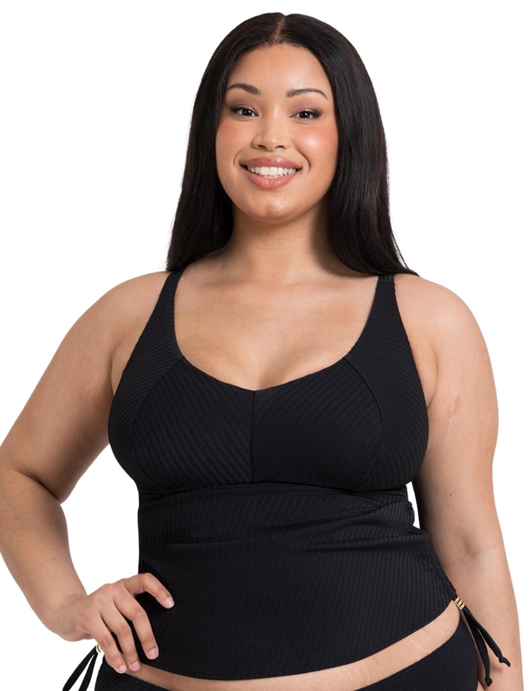 Add some chic classics to your suitcase this season such as the Curvy Kate Jet Set tankini top. Let's start with the basics - the scooped neckline and full cup coverage provide the perfect amount of support and coverage, ensuring that you feel secure and in control. But what sets this tankini top apart from the rest is the wireless design, allowing for maximum comfort without sacrificing style. This Jet Set tankini features a beautiful twisted ribbed texture, adding a touch of flair and uniqueness to your swimwear. And with adjustable side ties, you can easily customize the fit to your liking. With its pull-on design, this tankini top is easy to slip on and off, making it the perfect option for a day at the beach or pool. And for those who want a complete look, don't forget to check out the matching coordinates