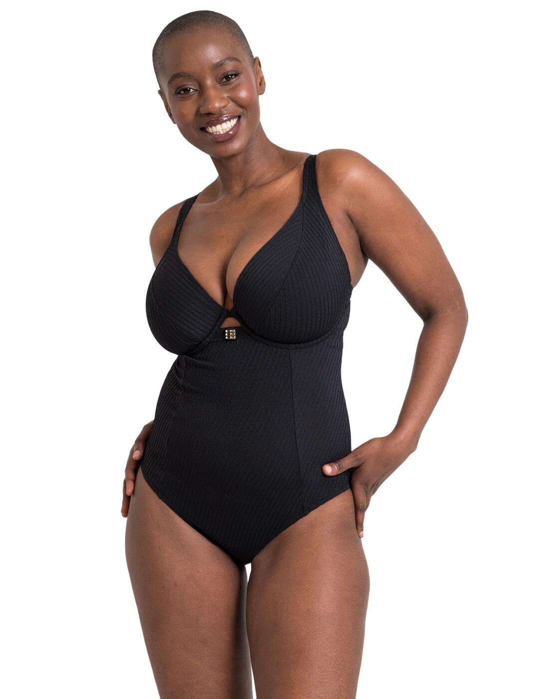 Upgrade your swimwear this season with the Curvy Kate Jet Set plunge swimsuit. With a deep plunging neckline, this swimsuit is a game-changer for all our curvy ladies. The twisted ribbed texture adds a touch of trendiness to this classic swimsuit, making you stand out from the crowd. This swimsuit is underwired, providing your bust with the perfect lift and shaping. And trust us when we say, you won't even notice the lack of padding, just enjoy the ensured ultimate comfort. To add a touch of glamour, there's gold hardware on the centre front of the swimsuit, giving it a glamorous and stylish finish. And for those who love a little extra detail, there's a keyhole at the centre front to make this swimsuit truly unique. Adjustable convertible straps and a classic back clasp make sure that this swimsuit fits you like a glove. And for all our fashion-forward ladies, we've got you covered with matching coordinates available to complete your poolside look.