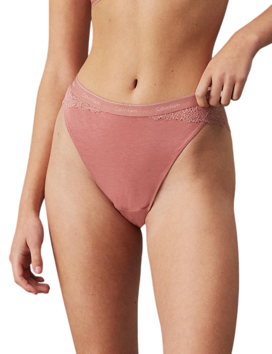 Treat yourself to some new designer pieces such as the Calvin Klein Modern Lace tanga brief. With its high waistline and leg rise, this brief offers just the right amount of coverage and shows off your beautiful curves. The lace sides and back add a touch of femininity and elegance, making you feel effortlessly alluring. But don't let the delicate lace fool you, the smooth opaque front provides ultimate comfort and ensures a seamless look under any outfit. As a signature of Calvin Klein, the waistband features the iconic logo, elevating this tanga brief to be more than just a piece of lingerie, but a fashion statement. And with cheeky rear coverage, you'll feel just the right amount of playful and flirty. Complete the set with matching coordinates, available with the same alluring lace and signature waistband today!