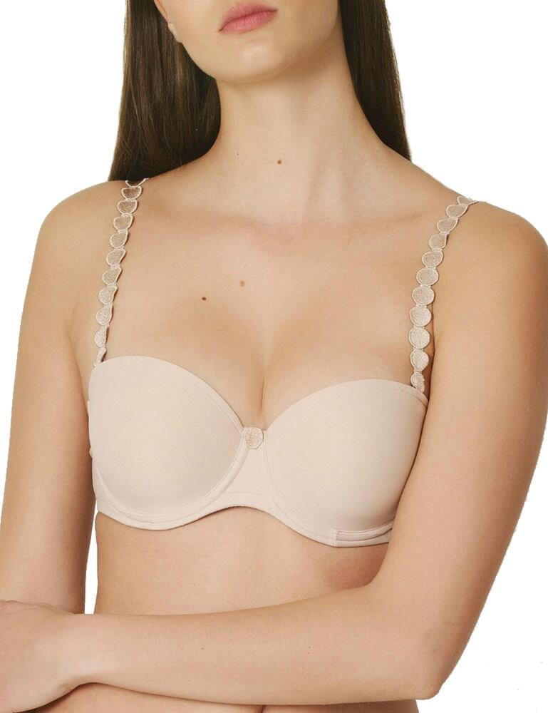 Look fabulous in this Tom padded strapless bra by Marie Jo. Crafted from soft and smooth fabric that feels luxurious against your skin. Featuring seamless bandeau style cups offering an excellent boost whilst allowing for a more modest cleavage. The underwiring offers great support and uplift. Decorated with pretty embroidery on the straps and centre panel. The straps can be individualised and converted into a halterneck or removed completely if needed. Add this refined and elegant bra to your lingerie collection!  Refined and chick design Strapless bandeau style Seamless design Padded and underwired cups Adjustable and convertible straps Matching coordinates available Composition: 39% Polyamide &pipe; 35% Polyester &pipe; 26% Elastane Listed in UK Sizes  43008-78585-1048401 0120828  Padded Strapless Bra
