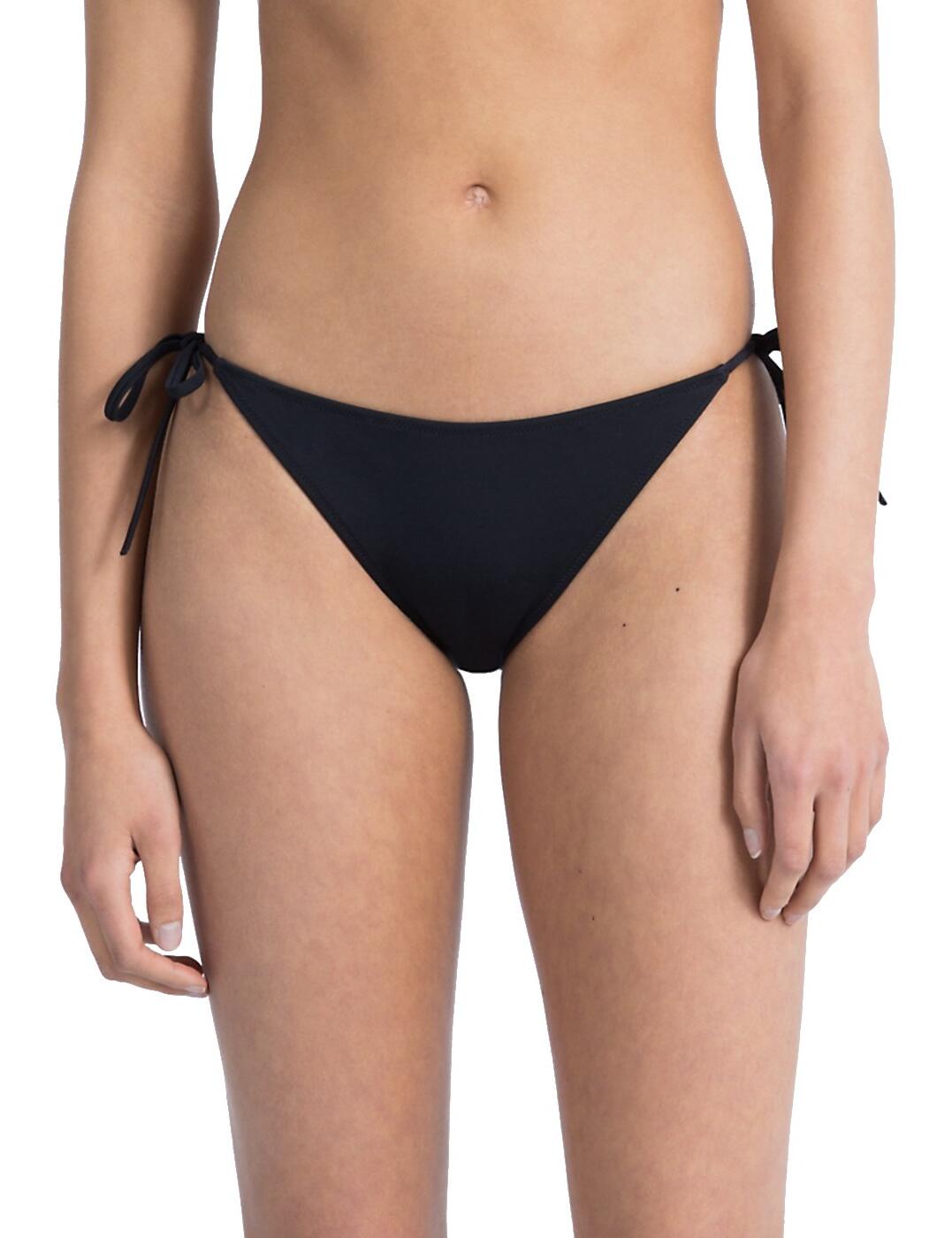 Hit the beach in this sporty-chic tie side bikini brief by Calvin Klein. Featuring the popular tie-side bikini bottoms offering cheeky rear coverage and a medium rise. Decorated with a bold iteration of the iconic CK logo at the rear. These comfortable and fashionable bikini briefs pair perfectly with the matching top from the Intense Power range.  Chic and sporty design Adjustable tie sides Medium rise waist Cheeky Brazilian coverage Branded logo at the rear Matching top available Composition: 80% Polyamide &pipe; 20% Elastane Listed in UK sizes  43195-79124-1056083 KW0KW00215094 Tie Side Brief 