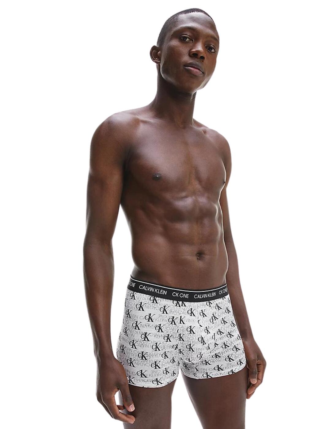 Calvin Klein's CK One trunks are made with superior comfort in mind. The soft cotton stretch material gives a snug fit, kept in place by the Calvin Klein branded elastic waistband. These trunks have a mid-rise waist and are a mini short cut, coming to your upper thigh.  Mid-rise waist Mini short style CK branded elastic waistband Stretch fit Soft cotton blend Country of origin: India Composition: 95% Cotton &pipe; 5% Elastane Listed in UK sizes  57566-101610 000NB2216A Men's Brief