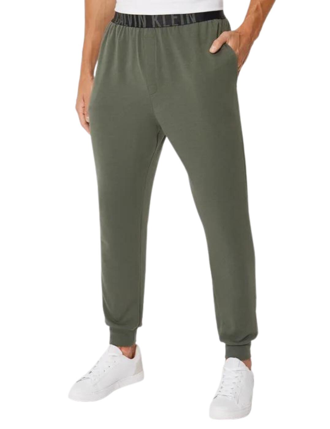 Calvin Klein's Intense Power joggers are versatile and on-trend with tapered legs and rib-knit cuffs at the ankles. Featuring side seam pockets for carrying the essentials, these joggers are perfect for a busy day running errands or a day spent lounging at home watching TV. These joggers are made from soft cotton stretch jersey to feel comfortable and lightweight.  Cuffed ankles Side seam pockets Elastic waistband Cotton stretch jersey Mid-rise waist Tapered leg Country of origin: Sri Lanka Composition: 57% Cotton &pipe; 38% Polyester &pipe; 5% Elastane Listed in UK sizes  57664-101730-1323236 000NM1961E Men's Joggers