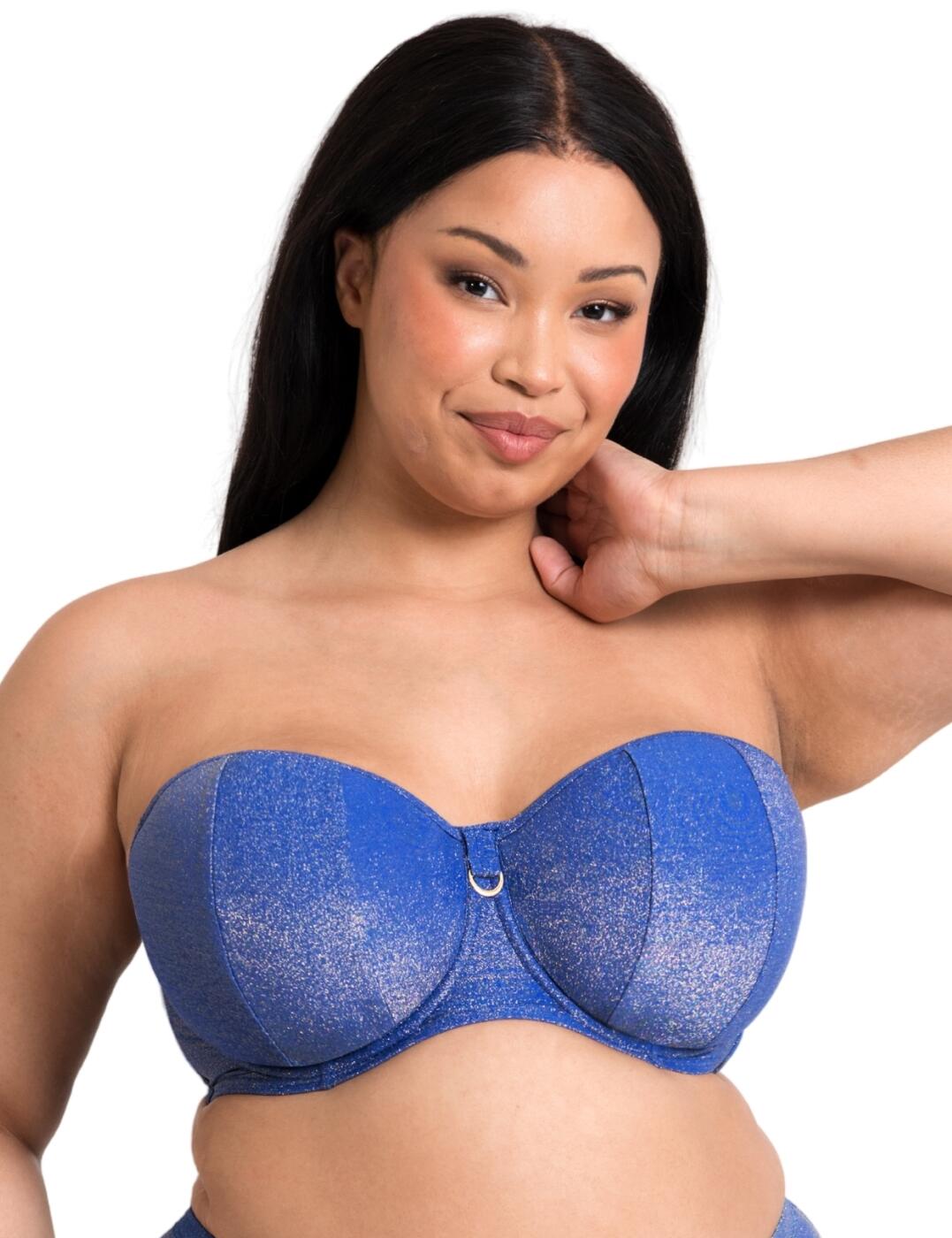 This bandeau bikini top from the Curvy Kate Sapphire Seas collection adapts effortlessly to your desires, designed for versatility it offers detachable straps so you can keep those tan lines away or or add extra support if needed. The padded underwired cups provide excellent shape, ensuring a flattering fit and comfortable wear all day long. Adorned with a stunning all-over sparkle design and D-ring charm details add a touch of glamour to complete this irresistible ensemble. It ensures a secure fit thanks to the clasp closure. Browse the matching swimwear items that are available from the Sapphire Seas range to complete the look!
