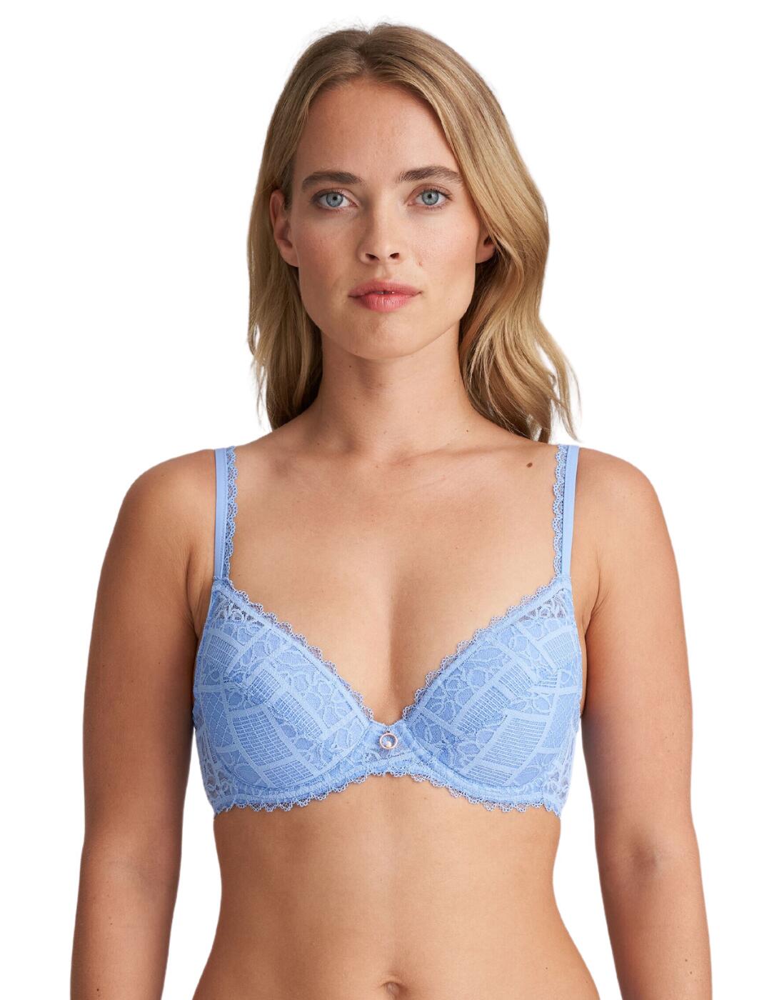 The Marie Jo Jadei push up bra is the ultimate must-have for the sophisticated woman seeking the pinnacle of comfort, versatility, and style. The padded removable cups offer that extra lift you've been dreaming of, letting you customize your cleavage to suit any outfit or occasion. Whether you want a little boost for a night out or a natural look for everyday wear, this bra has got you covered. Not only does the Jadei push up bra provide impeccable support with its underwired construction, but it also boasts stunning lace patterned cups that add a touch of elegance and femininity. The lace back is breathable, ensuring that you stay comfortable throughout the day whilst the metallic rose gold-tone charm at the center front adds a touch of glamour. Adjustable straps and a hook and eye fastening allow you to find your perfect fit. Complete your luxurious lingerie collection with the Jadei coordinating items, creating a seamless and elegant look!  Lace covered padded cups Removable pads for versatility Sophisticated style and detail trim Gorgeous metallic charm detail Underwired supportive fit Breathable lace back Adjustable straps Hook and eye fastening Composition: 56% Polyamide &pipe; 36% Polyester &pipe; 8% Elastane Listed in UK sizes  62285-107625-1427054 0102767 Push Up Bra