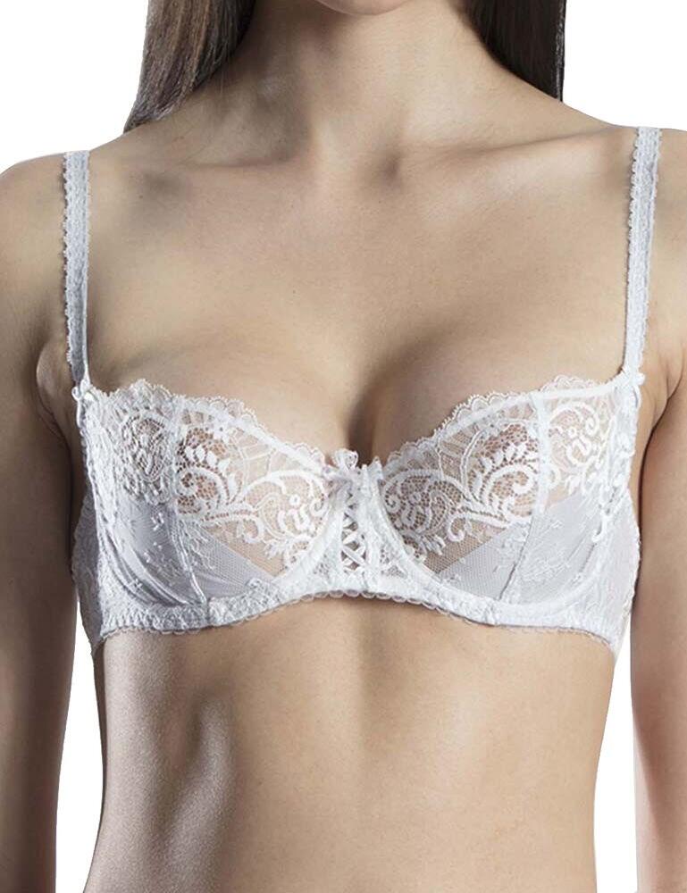 Step into luxury thanks to this exquisite half cup bra from the Courbes Divines range by Aubade. From afar, it is evident that this bra is made up from a gorgeous embroidered lace detail, living up to the high-quality Aubade name. However, upon closer inspection, it is evident that this bra has gorgeous intricate details which truly make this bra a work of art. From the gorgeous embroidered design on a semi-sheer lace panel, to gorgeous petite bows, to a delicate satin cross accent in the centre. The cups are underwired yet non-padded for a natural uplift. The straps are adjustable, allowing you to find just the right fit for you. Pair with matching items from the Courbes Divines range for a ravishing look.  Stunning, pretty design Comfortable fit Contemporary embroidered lace styling Underwired, non-padded cups for a natural look and lift Secures at the rear with hook and eye fastening Adjustable straps Composition: 76% Polyamide &pipe; 24% Elastane Listed in UK sizes  43868-80676-1098487 OA14 Half Cup Bra