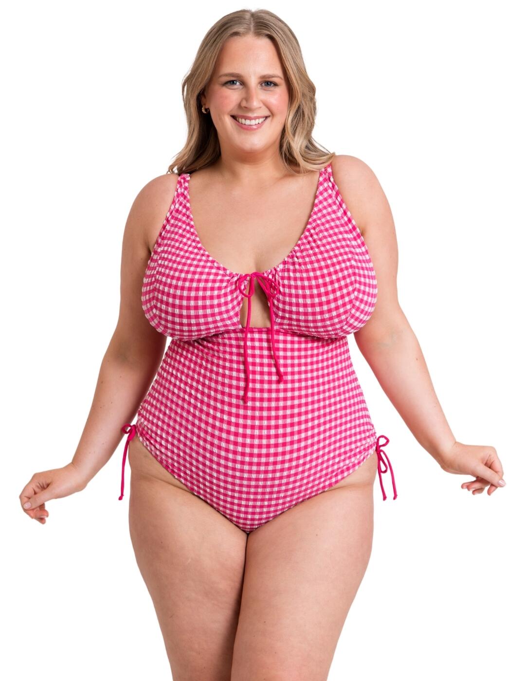 Slip into summer sophistication with this swimsuit from the Curvy Kate holiday check collection. Crafted to make every swim comfortable, it is non-padded, wireless and has a stretchy fit to ensure easy movement. It features a flattering V neckline and offers moderate rear coverage with tie adjustability for optimal comfort. This vibrant style offers all the fun you need in a swimsuit while still supporting your holiday needs, and it has a playful keyhole design on the back and a classic plastic back clasp closure for easy wear. Make responsible fashion choices with this swimsuit as it is crafted from 52% recycled polyester. Made complete with a mini cut-out in the centre with a tie bow.