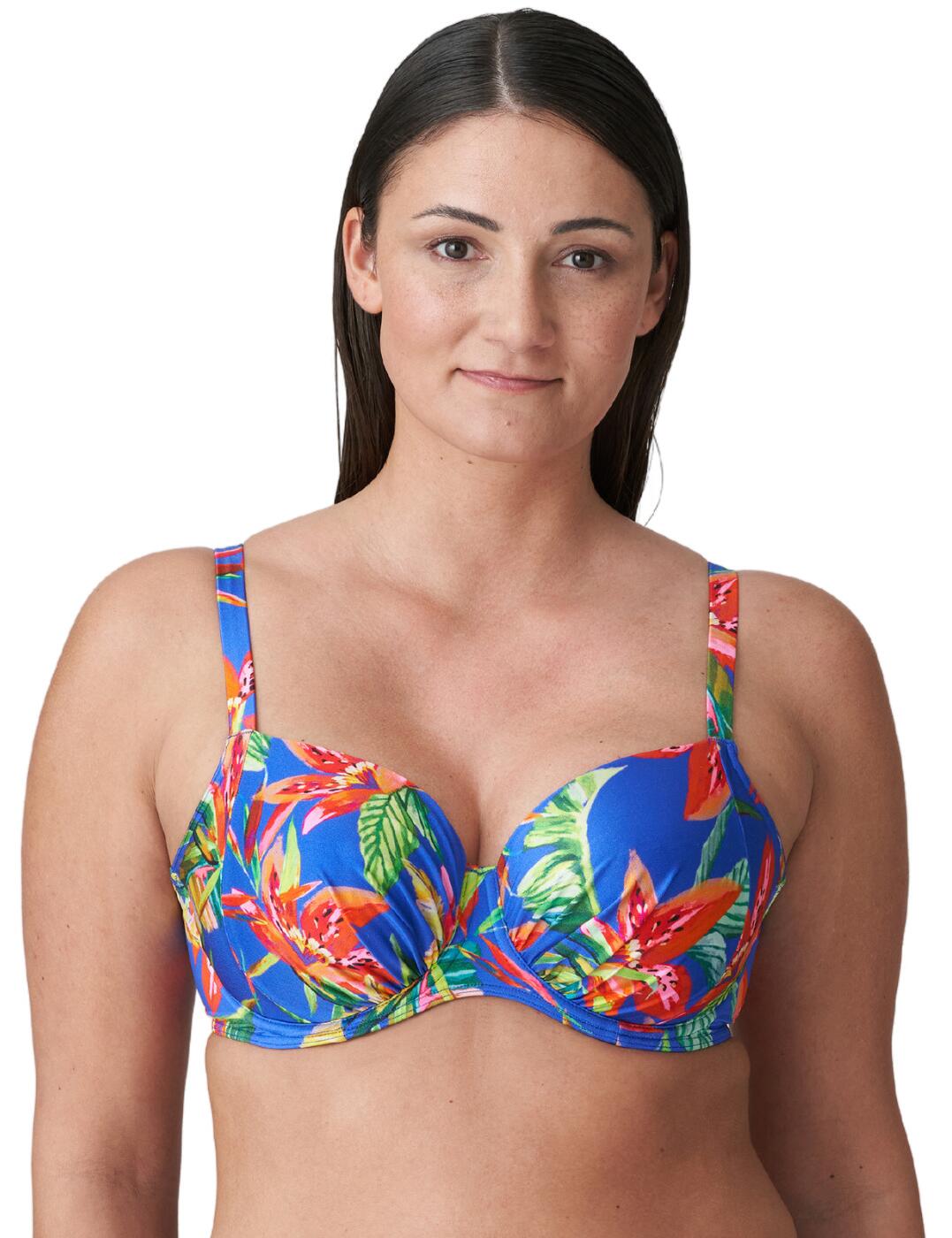 Whether you're poolside or beachside, turn heads with the Prima Donna Swim Latakia padded balcony bikini top. Crafted from luxurious fabric and boasting an eye-catching and colourful tropical print, this top is sure to transform your look. The underwired padded cups offer ultimate support while raising and shaping for a flattering contour, while the adjustable straps ensure the perfect fit. With its elegant ruching across the cups and subtle clasp closure at the back, this piece is designed to provide stylish support all day long. Complete your swimwear look with matching bottoms for extra glamour!