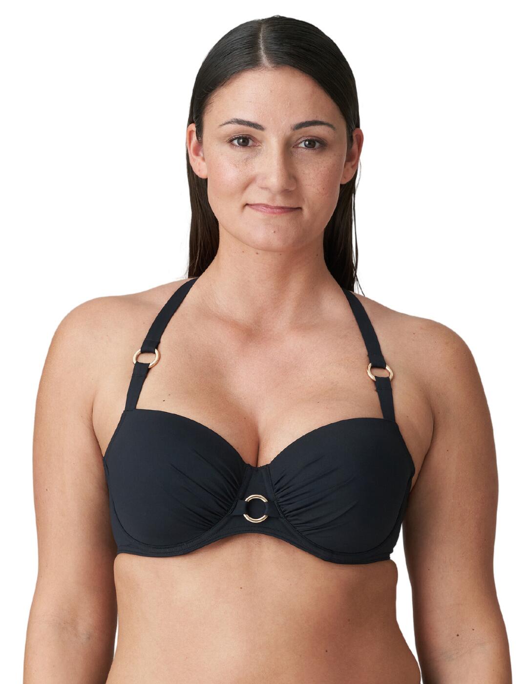 Make a statement this season with Prima Donna's gorgeous Damietta balcony bikini top. Crafted with luxurious fabrics, this top is packed with all the features you need for an enjoyable time spent by the pool. With its padded cups and underwired design, this top gives you a supportive, comfy fit. The clip fastening allows you to adjust the fit for maximum comfort, while the adjustable shoulder straps guarantee your straps will stay in place all day. Not to mention, this top is elevated with metallic ring details that give it a classic edge. Plus, you can complete the look with an on-trend strappy detailing and a necktie fastening. If that wasn't enough, there's a wide range of matching swimwear pieces available because Prima Donna believes you deserve only the best when it comes to beachwear.
