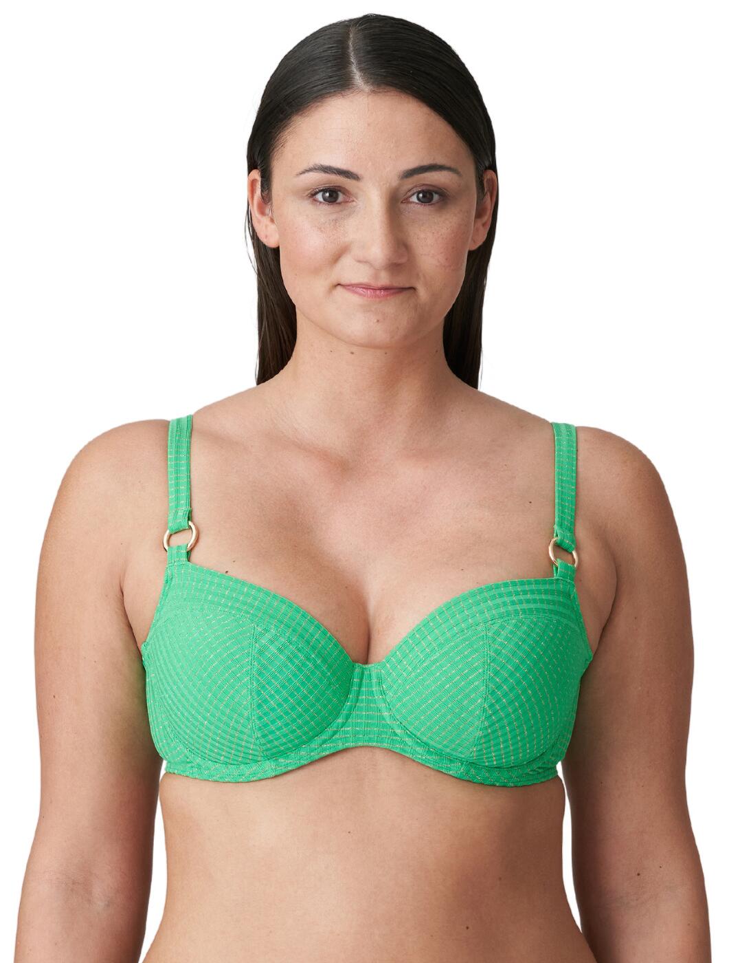 This gorgeous full cup bikini top from Prima Donna's Maringa range offers a timeless elegance that will ensure you feel beautiful on your next holiday or trip to the pool! Full coverage with a clever three-piece cup construction gives you the perfect amount of lift even in larger sizes while giving you confidence and security no matter what your day entails. The ribbed fabric exudes luxury and a retro feel, and the subtle sparkly accents running through the material further enhances the opulence of this piece as they light up in the sun! A truly sophisticated and eye-catching look! The adjustable straps, plastic clasp closure on the back, and flattering use of underwiring offer exceptional support and a customisable fit. Pair with matching briefs from the Maringa range to elevate this look even further!  Luxury full cup bikini top Full cup coverage Gorgeous ribbed fabric Subtle, shimmery accents throughout Adjustable straps Plastic back clasp closure Underwired and non-padded Matching items available Composition: 78% Polyamide &pipe; 13% Elastane &pipe; 9% Polyester Listed in UK sizes  62685-108090-1434617 4012010 Full Cup Bikini Top