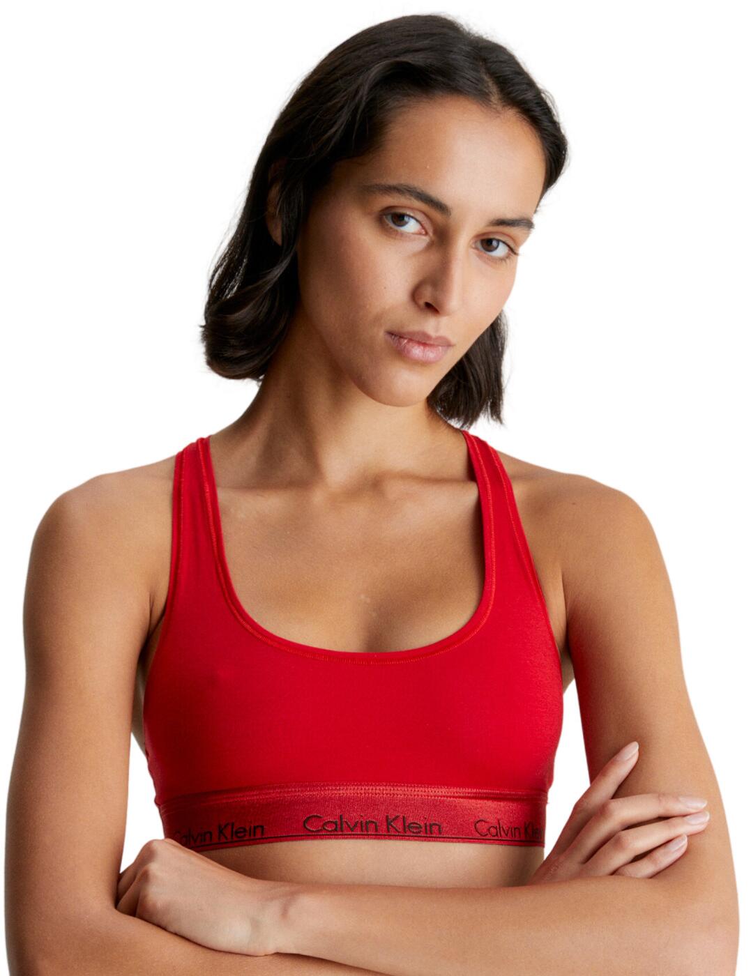 The Calvin Klein Modern Cotton Holiday bralette is the perfect piece for the modern woman s lingerie collection. Whether your style is bold and daring or understated and chic, this bralette will keep you looking and feeling stylish and comfortable all day long. With its non-padded and wireless cups, you ll get alluring natural definition without the extra bulk. The pull-on design is easy to get on and off and the fixed racerback lets you move around with ease and confidence. The stylish CK branding on the underband adds a subtle yet stunning touch. It looks great by itself or pairs perfectly with matching CK lingerie. Step up your lingerie game with the Calvin Klein Modern Cotton Holiday bralette.