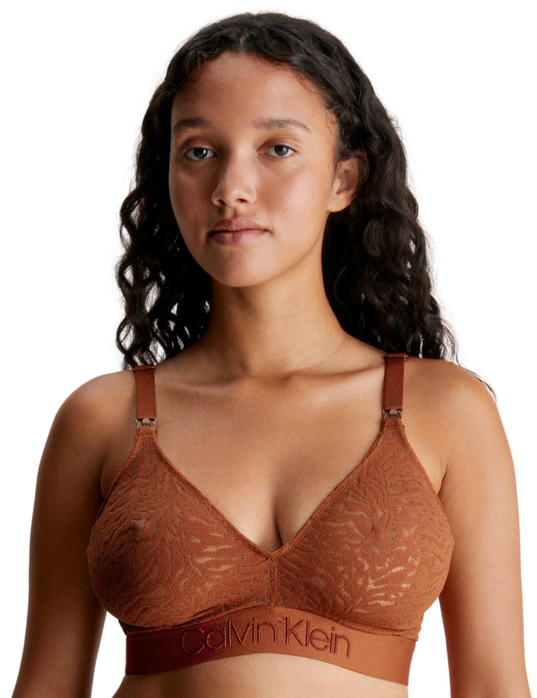Are you looking for a designer maternity bra that's comfortable, supportive and fashionable? Look no further than the Calvin Klein maternity bra! Boasting an ultra-feminine stretchy lace design, this bra is designed with a fuller cup and wide elastic shoulder straps for optimum support. It also features a cotton inner sling and drop-down nursing clips that provide convenience. To keep you comfortable and supported, its adjustable shoulder straps and hook fastening at the back give you the perfect fit ensuring you look as good as you feel. Not to mention, its signature elastic underband gives it a designer flair. Whether you are expecting or nursing, this comfortable and fashionable maternity bra from Calvin Klein is the perfect addition to your wardrobe.  Sleek maternity bra Wireless, non-padded cups Drop-down easy access nursing clips Hook fastening at the rear Adjustable shoulder straps Calvin Klein logo underband Full cup Matching coordinates available Country of origin: Sri Lanka Composition: 83% Nylon &pipe; 17% Elastane Listed in UK sizes  62809-108229-1436103 000QF7343E Maternity Bra
