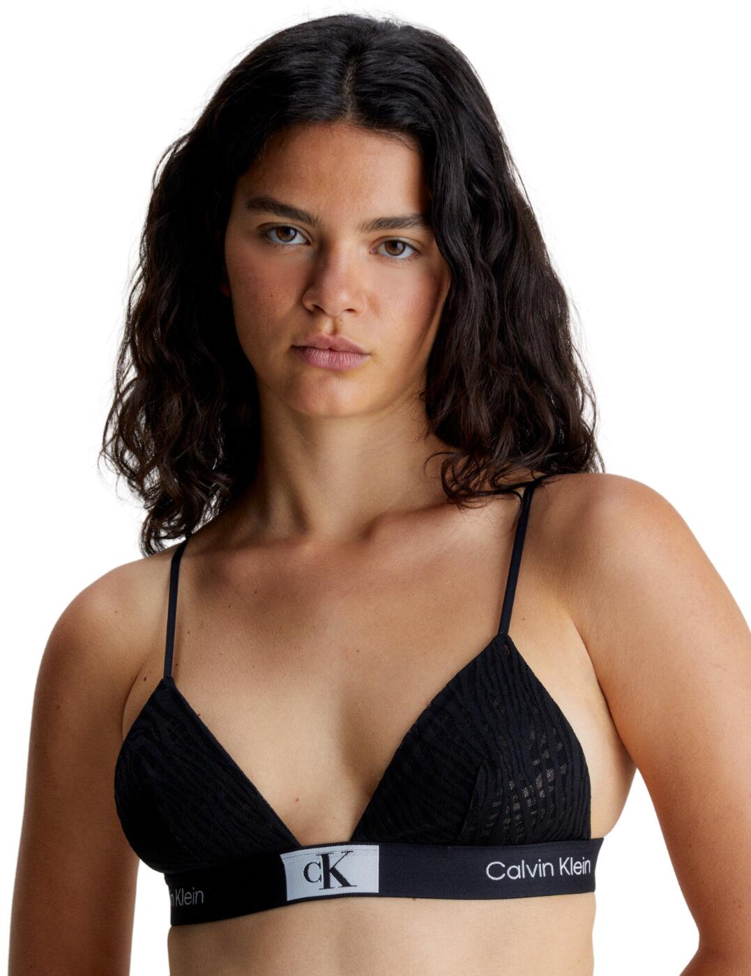 Say hello to the one and only Calvin Klein CK96 triangle bra! The epitome of designer lingerie, this revolutionary piece of lingerie is perfect for the woman who likes to leave a lasting impression. Combining classic Calvin Klein style with a modern-day twist, this piece is sure to have all eyes on you. The CK96 is made with a nylon elastane blend and uses recycled fibres, creating a semi-sheer finish with no padding and soft triangle cups. To ensure a personalised fit for your figure this piece boasts adjustable shoulder straps and a hook fastening at the back. The Calvin Klein signature elasticated underband finishes off this piece with a unique animal lace tiger pattern to make sure you stand out from the crowd.  Soft plunging triangle cups Hook and eye closure Adjustable shoulder straps Wireless Non-padded cups Signature Calvin Klein elasticated underband Country of origin: Sri Lanka Composition: 53% Recycled Nylon &pipe; 36% Nylon &pipe; 11% Elastane Listed in UK sizes  62862-108285-1436828 000QF7377E Bralette