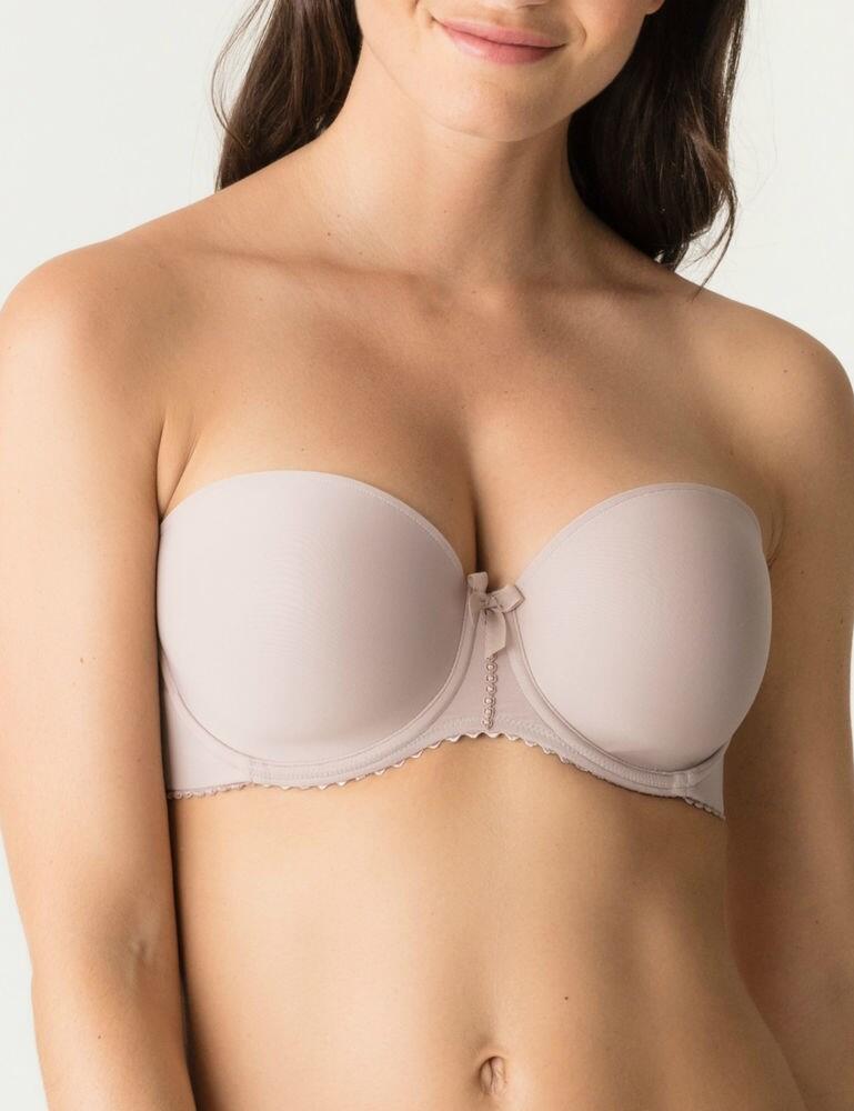 Introducing the Divine range by Prima Donna, boasting this gorgeous padded strapless bra. This bra is printed all over with a lace pattern to provide a feminine, light look, topped off by a cute bow in the centre. This bra is underwired and padded for better shape, support and uplift. The adjustable straps are detachable so you can wear this bra by itself or with the straps. This bra secures at the rear with a hook and eye closure and looks even better when paired with matching items from the Divine range.  Stylish, feminine look Printed on lace pattern throughout for a light feminine look Adjustable straps which are detachable Padded foam cups  Underwired cups for support Fastens with hook and eye closure at the back Matching co-ordinates available!  Composition: 51% Polyester &pipe; 37% Polyamide &pipe; 12% Elastane  Listed in UK sizes  44225-81661-1200204 0262658/59 Strapless Bra